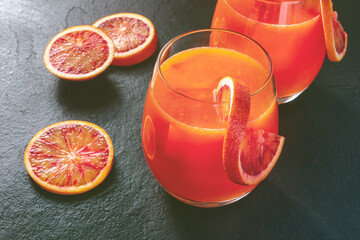 Orange cocktail, toned image with Sicilian oranges