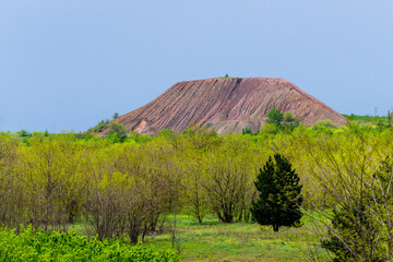 View of slag heaps of iron ore quarry. Mining industry