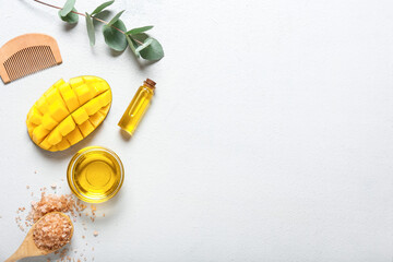 Composition with mango essential oil on white background
