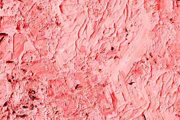 Pink abstract texture of surface covered with putty. Grain and noise effect.  Wall background...