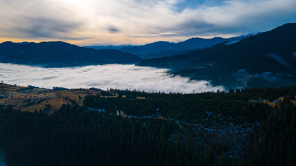 mountains tops high above clouds fog