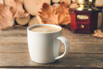 Cup of tasty latte on wooden background