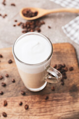 Glass cup of tasty latte on table