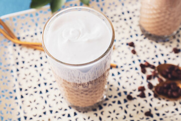 Glass of tasty latte, closeup