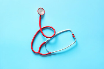 Fototapeta premium Modern stethoscope on color background
