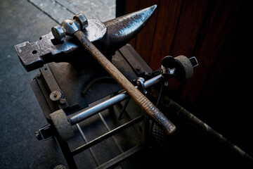 Blacksmith tools. Anvil and sledgehammer in the stable
