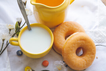 breakfast or snack with donuts and cup of milk