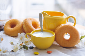 breakfast or snack with donuts and cup of milk
