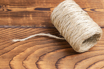 a roll of rope on a wooden table