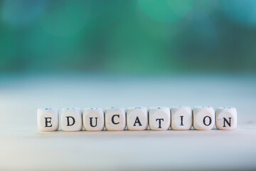 Words concept, EDUCATION word cube on bokeh blur background ,English language learning concept.