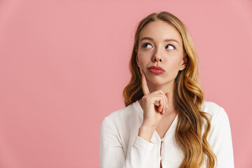 Attractive pensive young woman thinking