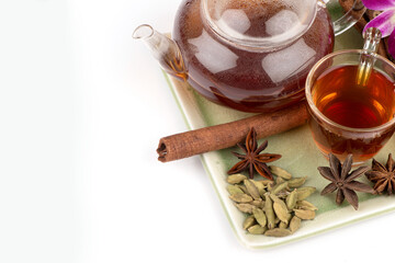 Green cardamom ,star anise ,cinnamon bark and tea isolated on white background.
