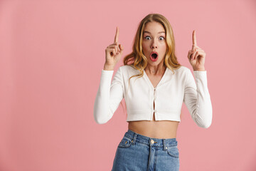 Attractive surprised young female with blonde hair