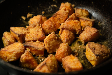 Fry pumpkin pieces in a preheated pan