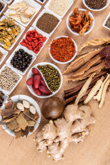 Set collection Clove, Anise, Licorice, Chrysanthemum, Lingzhi Mushroom, Jujube, Goji, Safflower and more on brown background.top view flat lay.