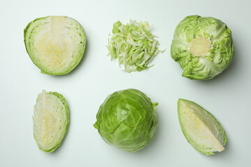 Flat lay with fresh cabbage on white background - obrazy, fototapety, plakaty