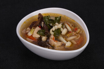 Thai style soup with meat and mushrooms