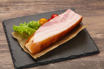 Smoked pork breast with salad leaves