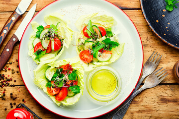 Spring vegetable salad on wooden table