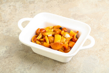 Marinated pickled honey mushrooms in the bowl