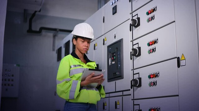 Engineer checking and inspecting at MDB panel , working with electric switchboard to check  medium Voltage Switchgear working in Main Distribution Boards factory.