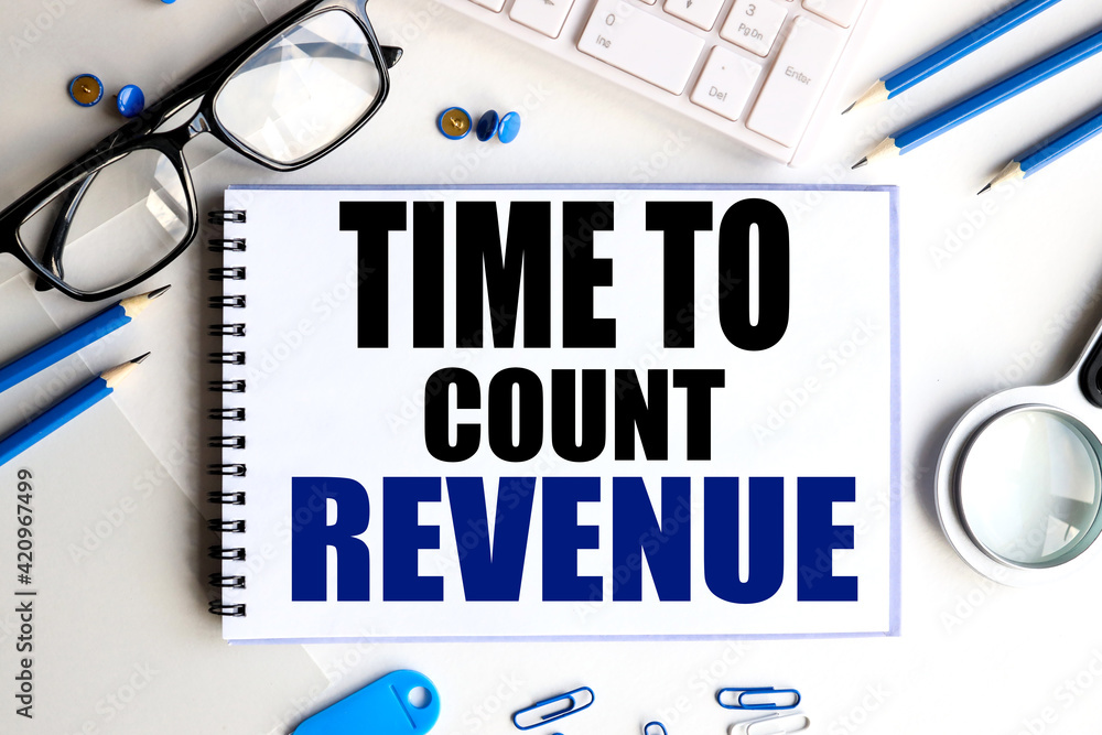 Poster time to count revenue. text on white notepad paper on light backgroundbusiness and financial conzept