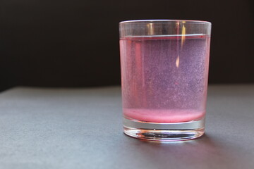 Compote juice mors milk nail pink on a black gray background with space for text and copyspace © Кристина Шоба