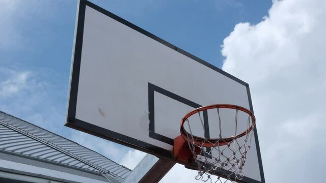 4k Footage Panning Looking Up At An Urban Basketball Hoop
