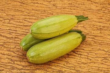 Young tasty zucchini over board