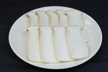 Fresh Japanese Eryngii Mushroom, thinly sliced  Arranged in a plate