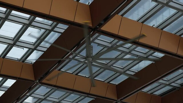 4k Footage Of A Large Ceiling Fan In An Outside Mall