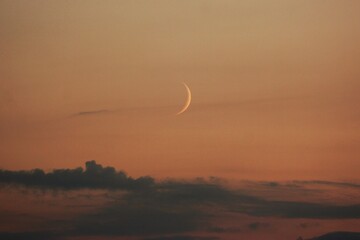 Clouds, sunset and the moon