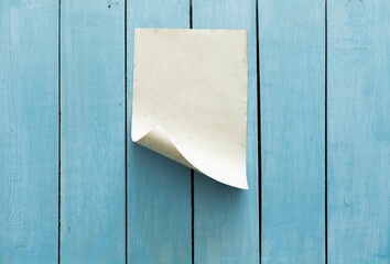 old paper on blue wall