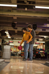 Couple enjoying bowling together.