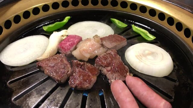 japanese barbecue meat,sausages and vegetables on grill