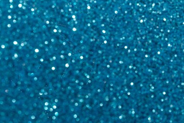 Abstract background of small bokeh turquoise colors and subtle water drops