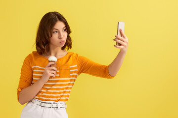 woman with vanilla ice cream making selfie