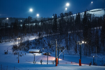 Ski slope in evening lights