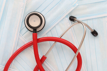 Stethoscope lies on medical protective masks closeup