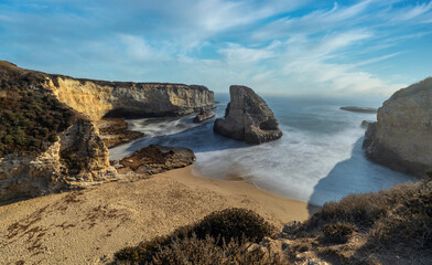 Long exposure shark fin cove, beautiful beach landscape on the coast of California highway, ocean, rocks, great sky, clear sunny weather