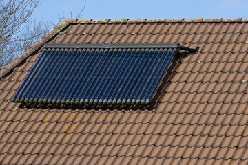 Fototapeta premium evacuated tube collector on a roof, solar thermal, solar water system