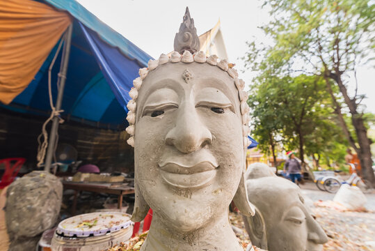Buddha head made of cement in a Thai temple