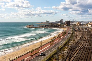 Industrial area in Tarragona; Railway tracks along a beach