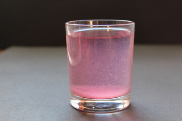 Compote juice mors milk nail pink on a black gray background with space for text and copyspace © Кристина Шоба