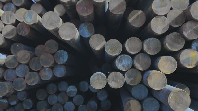 Metal billets, warehouse of metal billets at the factory, round metal billets