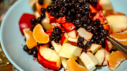 Close up healthy food breakfast with fresh fruits poured with sour cream and kefir yogurt. Layered...