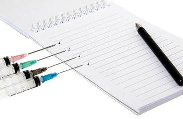 Notepad, pen, syringes, insulation on a white background