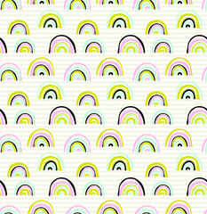 Vector seamless pattern with unusual rainbows drawn by children's hands. Trendy and fashionable print for boys and girls. Illustration for envelopes, textiles, notebooks, and holidays.
