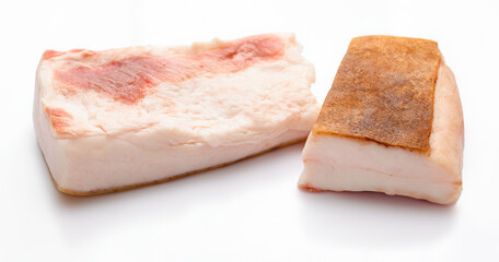 raw lard two pieces on white background, pork fat