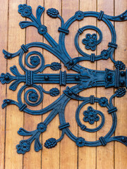 amazing black ironwork on wooden front door
